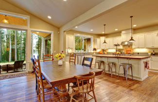 Well lit kitchen with recessed, pendant and under cabinet lighting