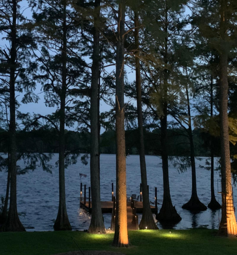 Landscape Lighting on a lake Dock at dusk.